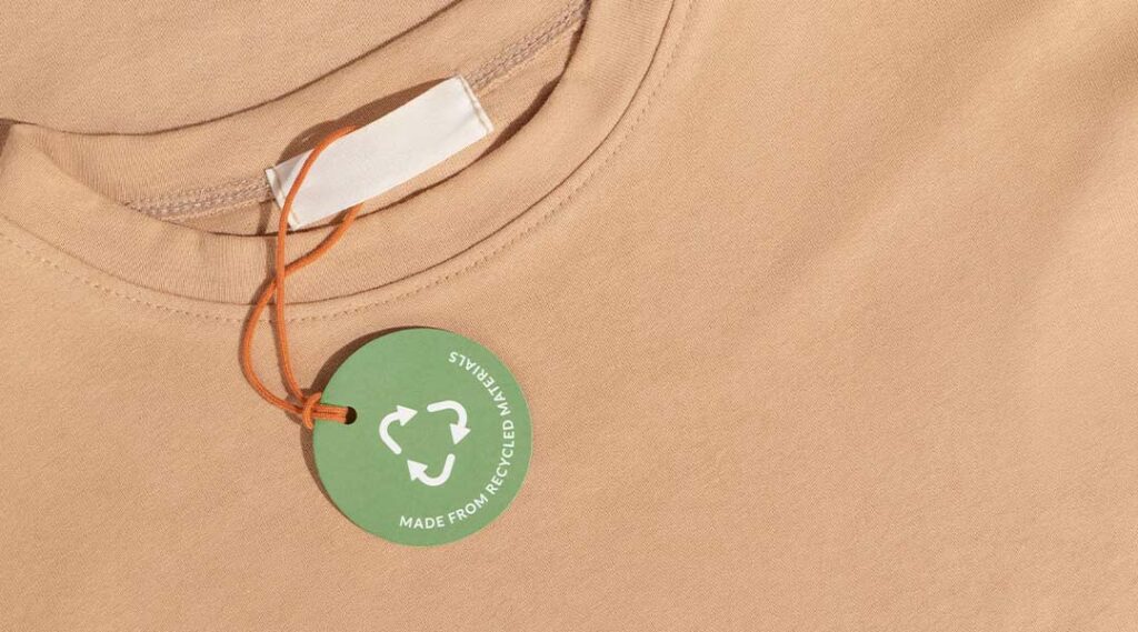 Etichetta rotorna verde con simbolo del riciclo