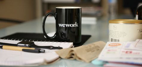 Tazza mug aziendale nera con personalizzazione grafica "We Work"