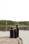Borraccia in acciaio inox riciclato con manico e tappo in legno 800ml color nero vista ambiente