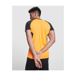 T-shirt sportiva per bambini a maniche corte 140 g/m2 Roly Bugatti color arancione immagine stile di vita