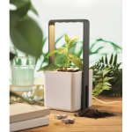 Vaso da interno con 4 luci LED sulla parte superiore color bianco vista ambiente
