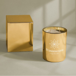 Candela profumata floreale a 3 stoppini in bicchiere di vetro lucido color oro seconda vista