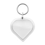 Portachiavi in plastica con anello metallico a forma di cuore color trasparente prima vista