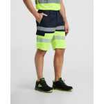 Bermuda bicolore multitasche ad alta visibilità unisex 210 g/m2 Roly Lada color blu mare terza vista d'uso