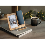 Caricatore wireless in legno con supporto per cellulare e cornice portafoto color legno vista ambiente principale