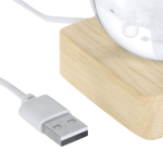 Decorazione natalizia a sfera in vetro con base in legno e luce calda