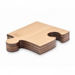 Quattro sottobicchieri in bambù a forma di puzzle color legno seconda vista